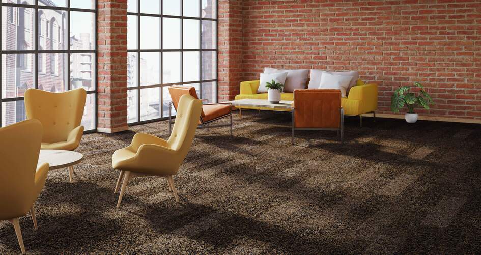 Fabromont Volta textile flooring in different shades of brown laid in a large, interior office space