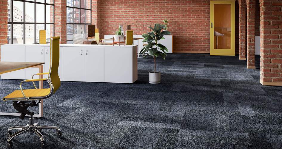 Fabromont Volta textile flooring in different shades of gray in a large, interior office space
