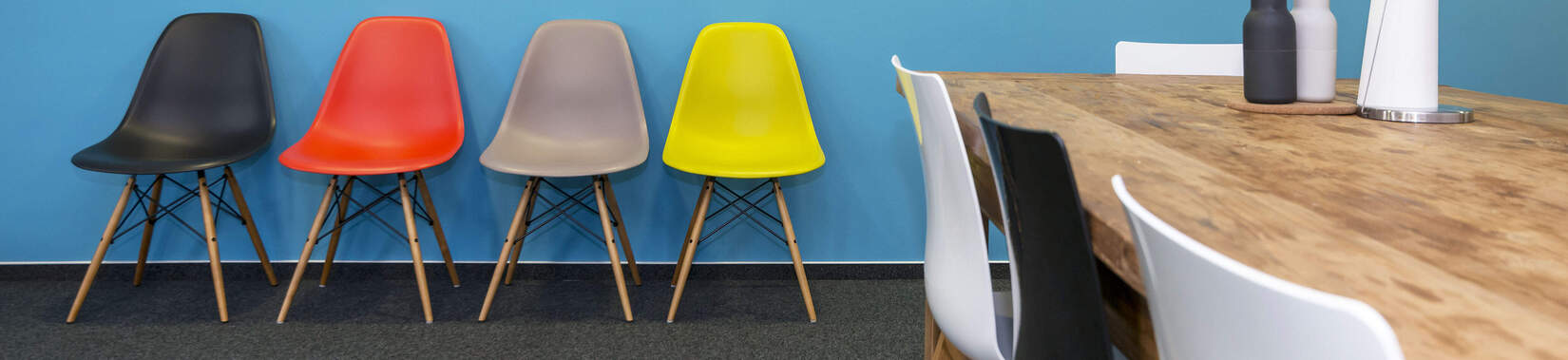 Colored chairs on grey Fabromont flooring